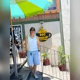 Jott Myth, standing outside a cafe
